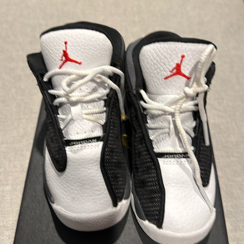 Jordan 13 retro black, university red and white used size 9 toddler.